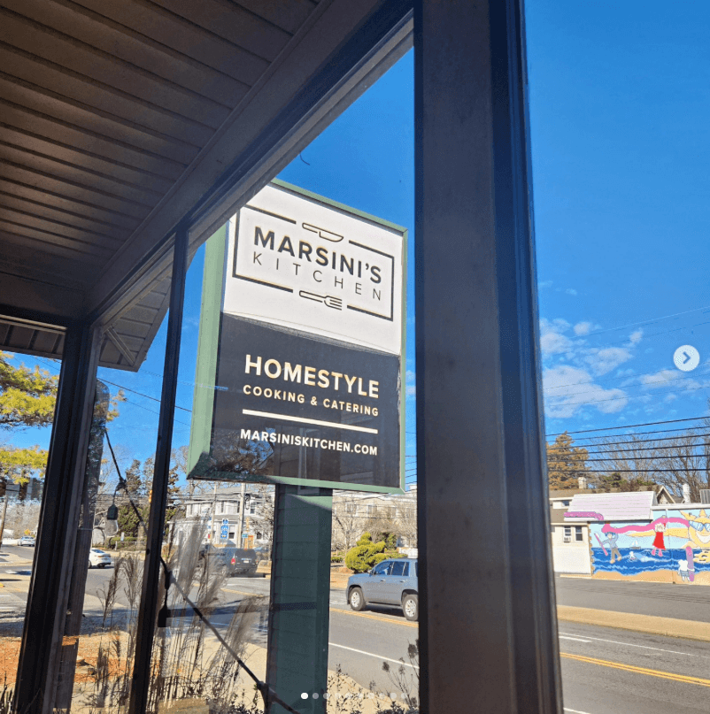Historical exterior view of the Marsini's Kitchen sign